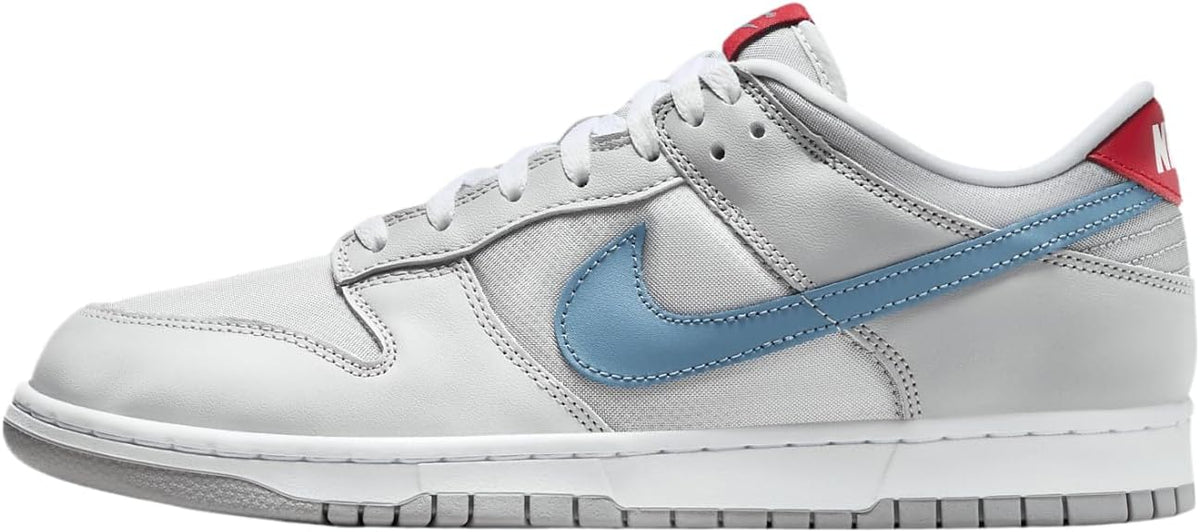 Nike Dunk Low QS low-top sneakers, metallic silver with light blue swoosh.