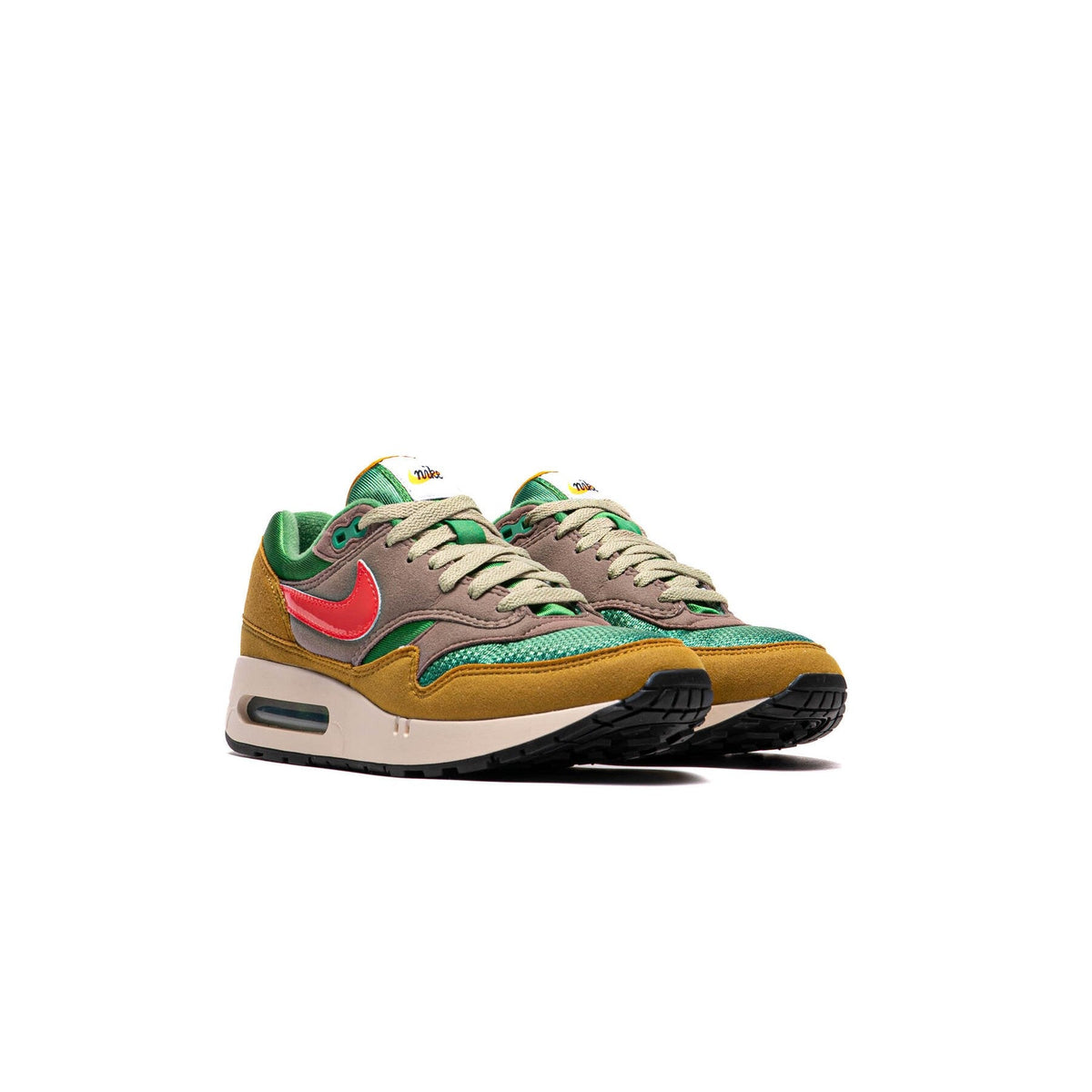 Air Max 1 PRM sneakers, side view; green-brown upper with red swoosh and tan laces