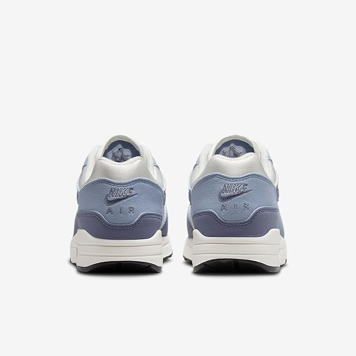 Nike Air Max 1 '87 sneakers, rear view with blue heel tabs and white outsole
