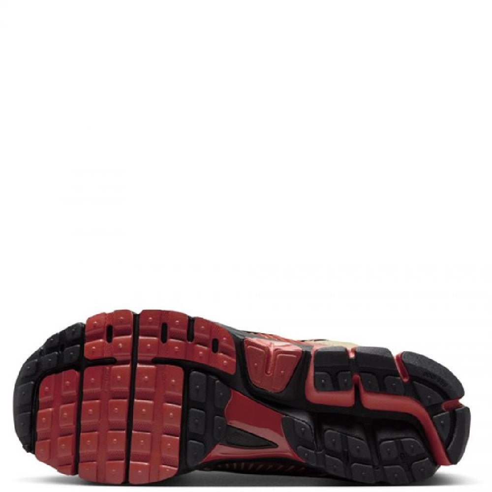 Nike Zoom Vomero 5 outsole view with red and black tread patterns