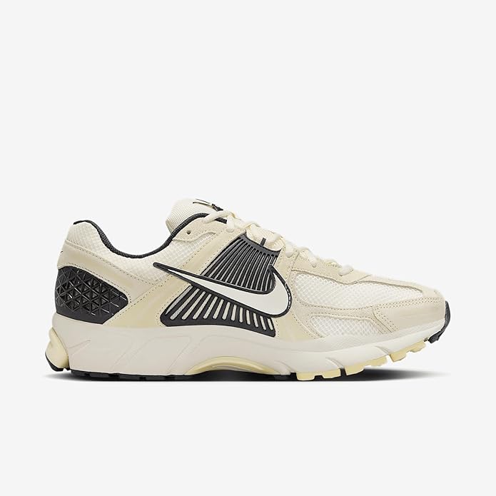 Men's Nike lace-up sneakers in pale ivory with black heel panel and swoosh