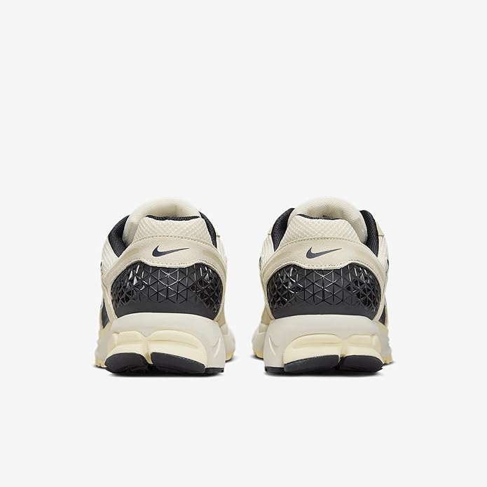 Men's Nike Zoom Vomero 5 sneakers with black heel counter and cream rubber sole