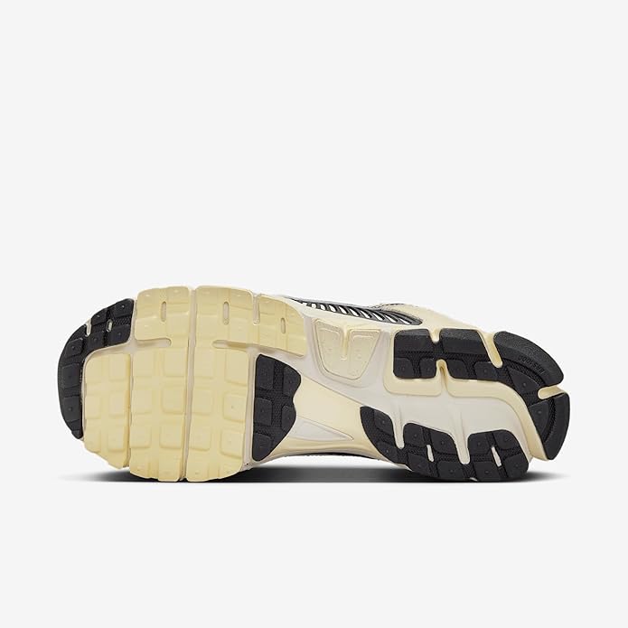Nike Zoom Vomero 5 outsole with cream tread and black rubber traction pods