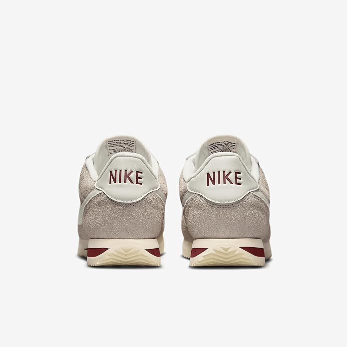 Men's Nike Cortez SE sneakers, back view with Nike logo on grey suede and cream heel