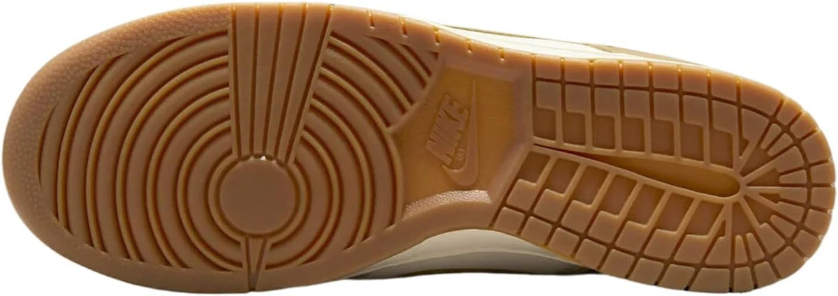 Nike Dunk Low rubber outsole with circular traction pattern and brown gum tread.