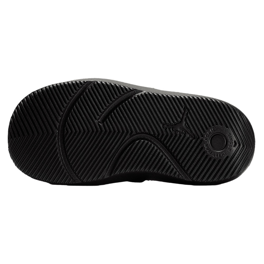 Black rubber outsole for kids slide sandals with tread and Jumpman emblem