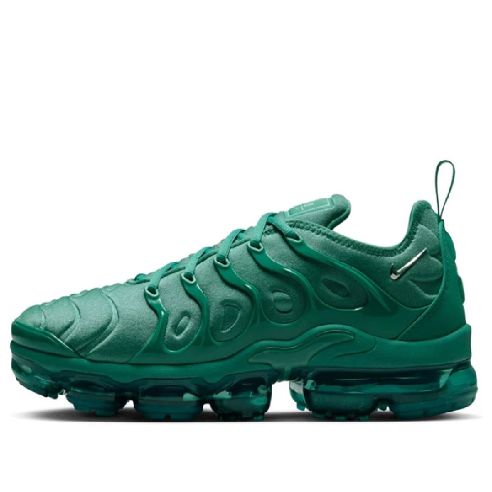 Green Nike Air Vapormax Plus running shoe with mesh-look upper, teal laces, and Max Air sole
