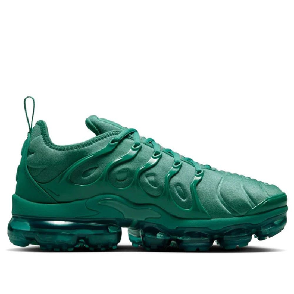 Green Nike Air Vapormax Plus sneaker, side view with swoosh, lace-up front, and clear teal pods