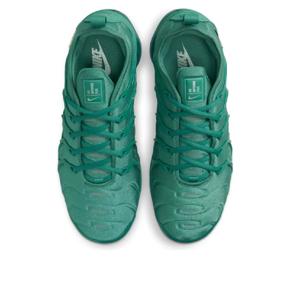 Green Nike Air Vapormax Plus sneakers, top view of closed toe and lace-up vamp