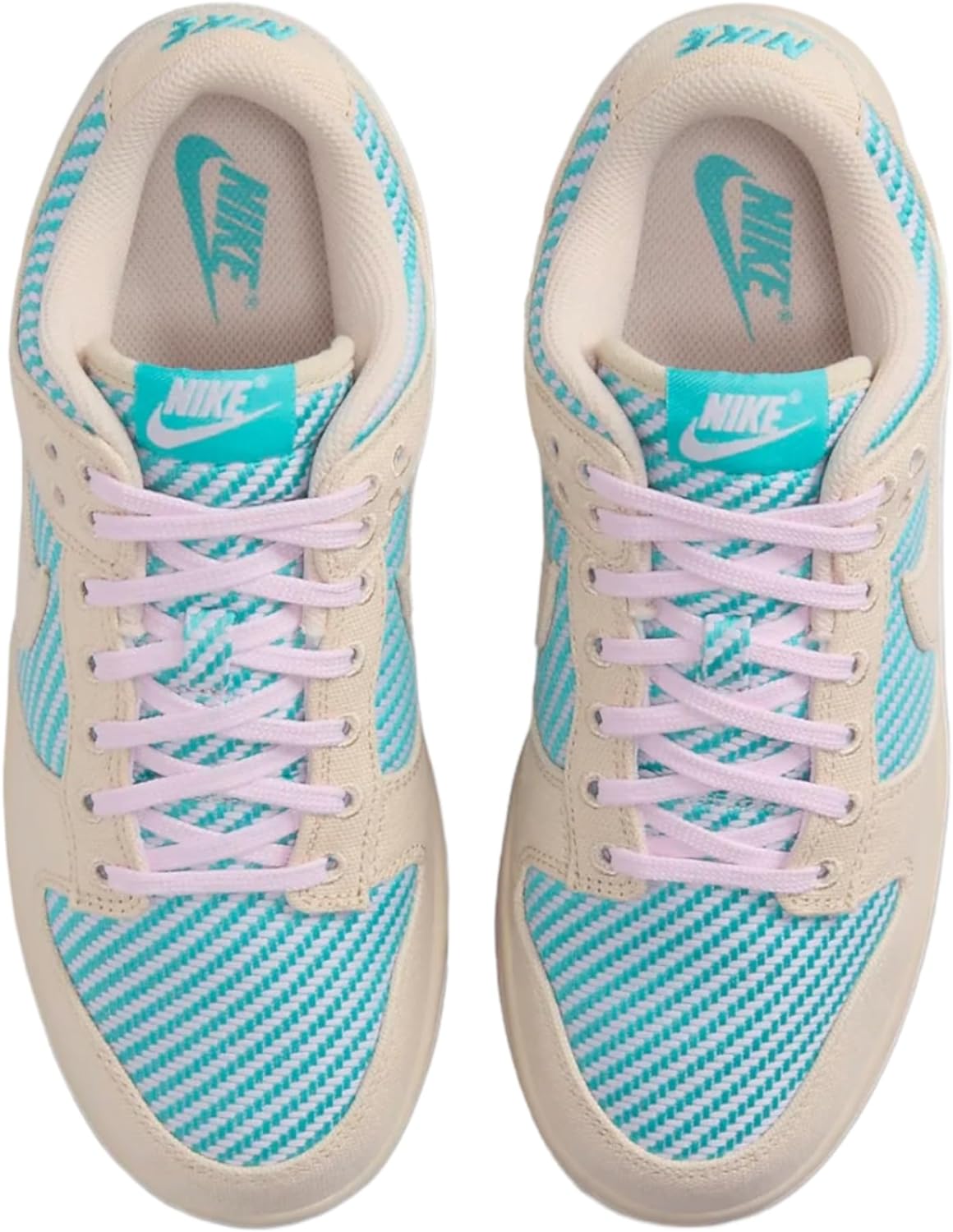 Women's Nike Dunk Low sneakers with lavender laces and teal Nike tongue branding.
