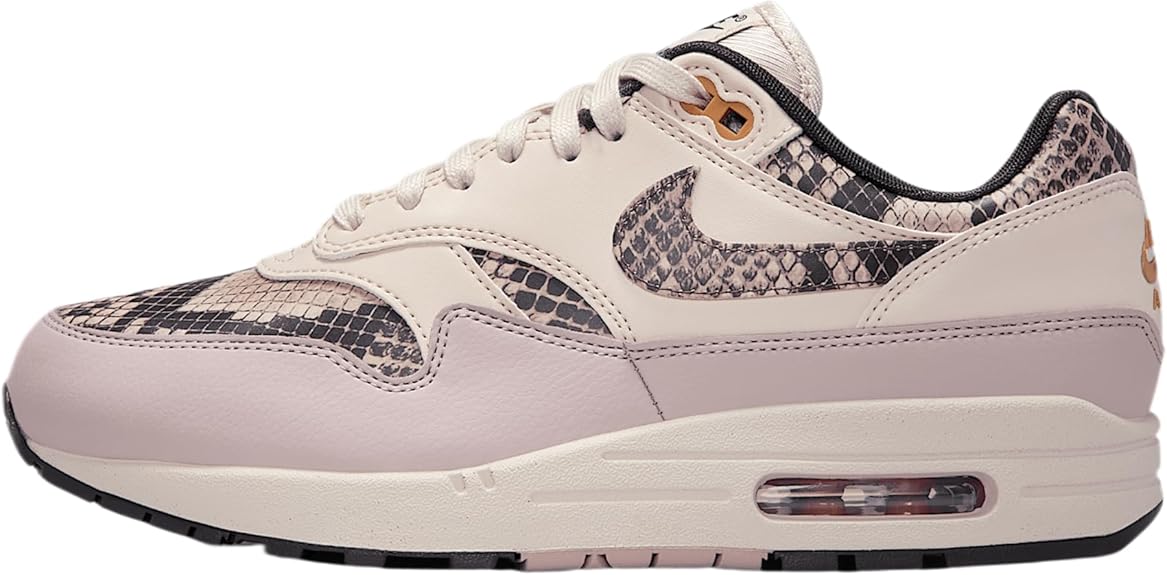 Light pink low-top sneakers with purple snake-print overlays and Nike Swoosh, air window