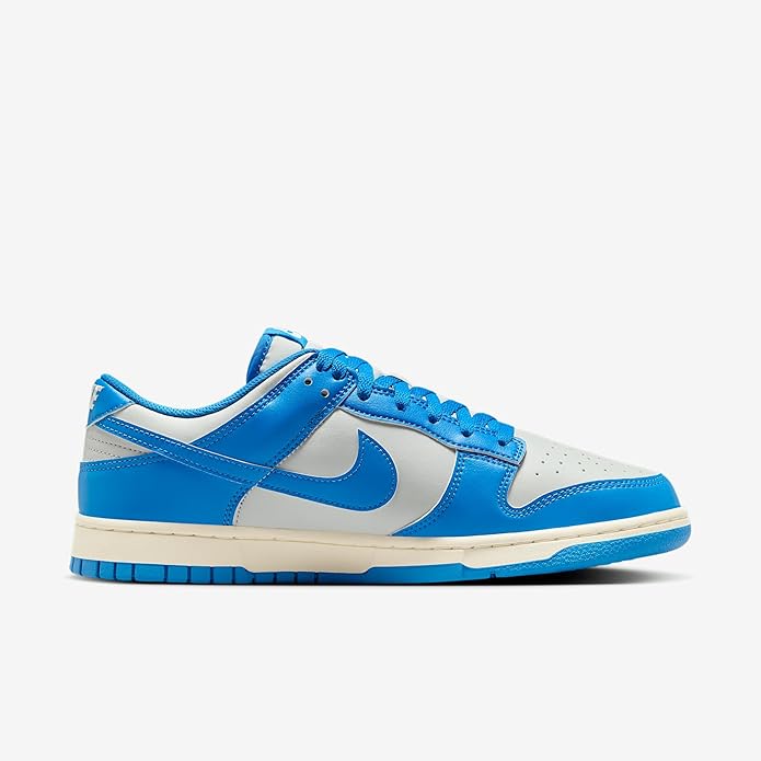 Low-top Nike Dunk sneaker in blue with white quarter panels and Nike Swoosh logo
