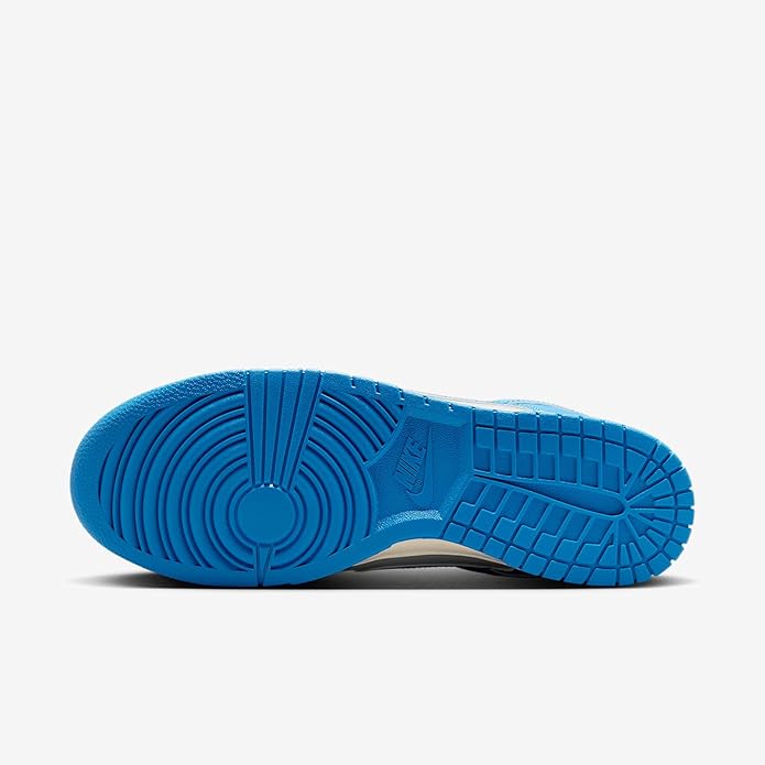 Nike Dunk low-top rubber outsole with blue tread and circular pivot design