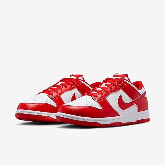 Nike Dunk Low sneakers, red and white uppers with lace-up front and Swoosh