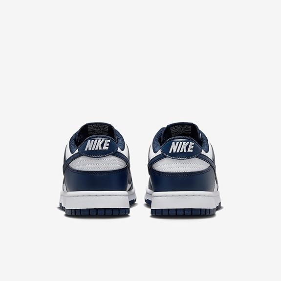 Nike Dunk Low sneakers with navy heel tabs and Nike logo on the back