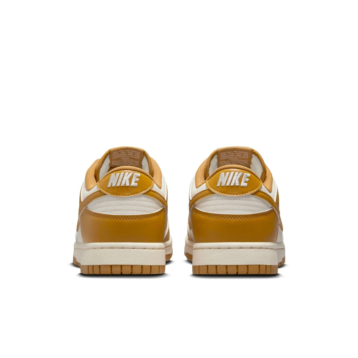 Nike Dunk Low retro sneakers heel view in pale ivory and wheat with Nike branding