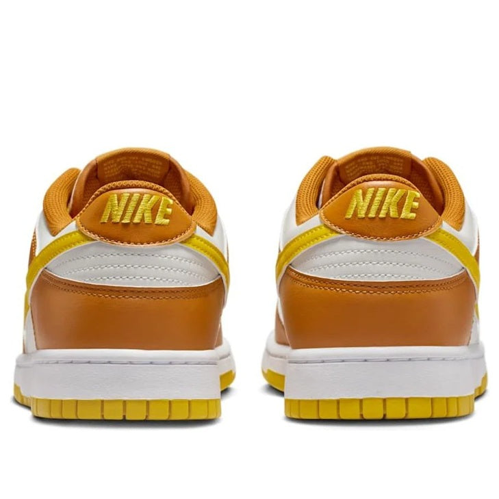 Men's Nike Dunk Low heel view with NIKE logo, brown and white upper and yellow outsole