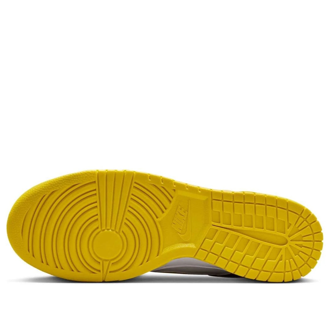 Nike Dunk Low rubber outsole in bright yellow with tread pattern
