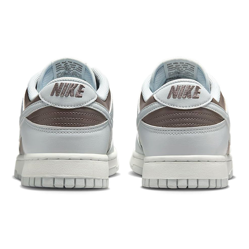 Low-top sneakers heel view with Nike logos on back and padded collar