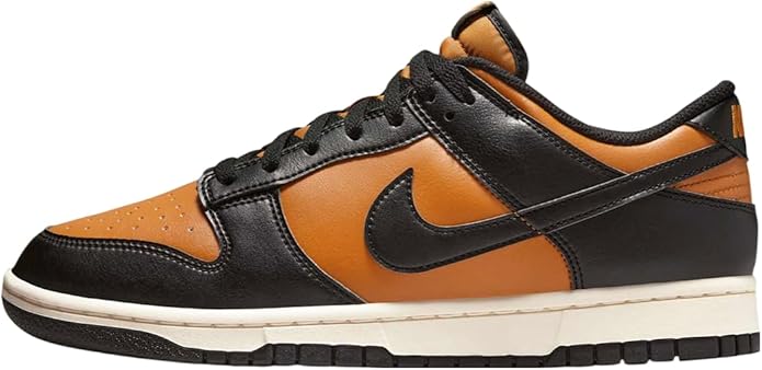Black and orange low-top sneakers with Nike swoosh, lace-up, rubber outsole