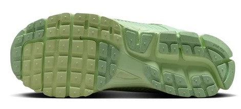 Men's Nike Vapor green outsole with textured traction pattern and molded cushioning.