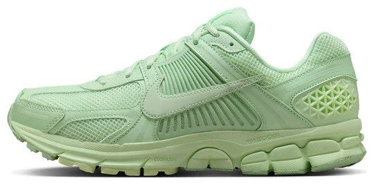 Men's Nike Zoom Vomero 5 running shoes in vapor green with mesh upper and lace closure.