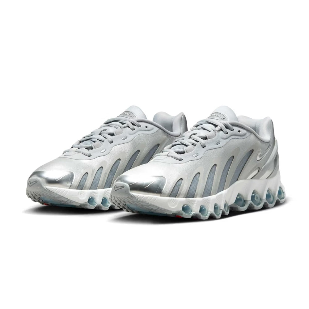 Pair of light grey Nike Air Max DN8 sneakers with metallic laces and blue air pods