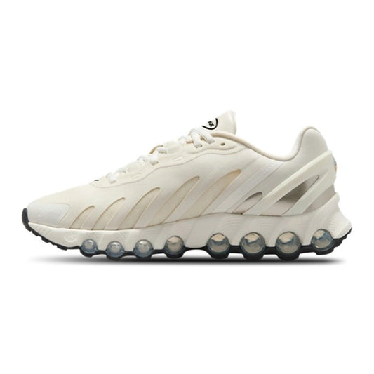 Nike Air Max DN8 sneakers in sail/black, side view with visible Air pods sole