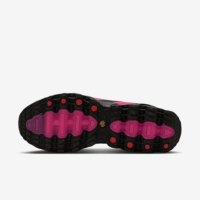 Women's Nike Air Max DN8 sneaker outsole with black rubber pods and fuchsia traction zones