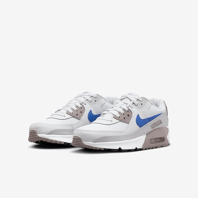 Big kid's Nike Air Max 90 sneakers, pair shown in white with blue swoosh and gray accents