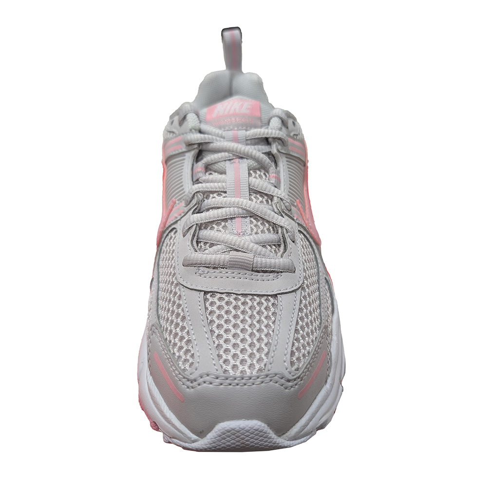 Kids Nike Vomero 5 lace-up sneaker, grey upper with pink heel tab and foam sole.