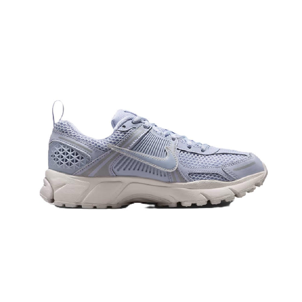 Big kid's Nike running shoes, light blue and white, angled side view
