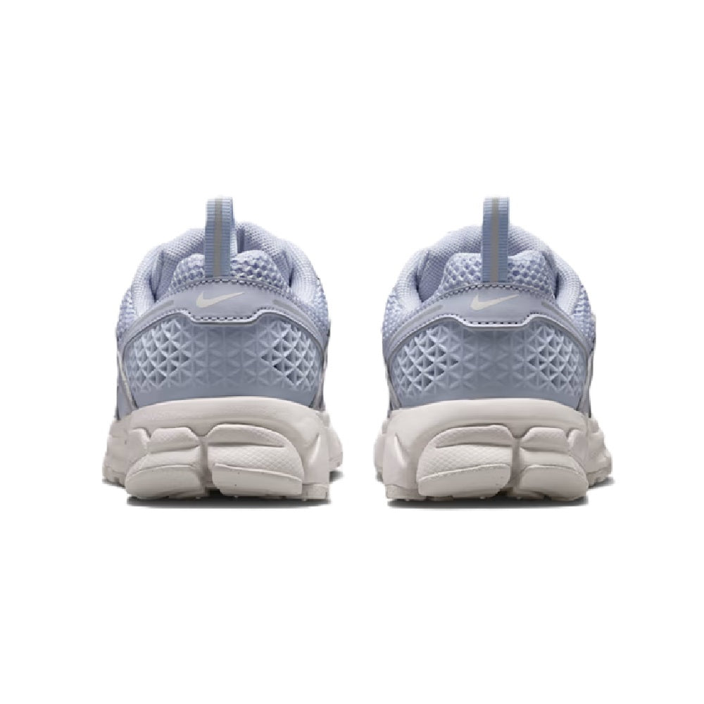 Big kid's Nike running shoes, light blue and white, rear heel view