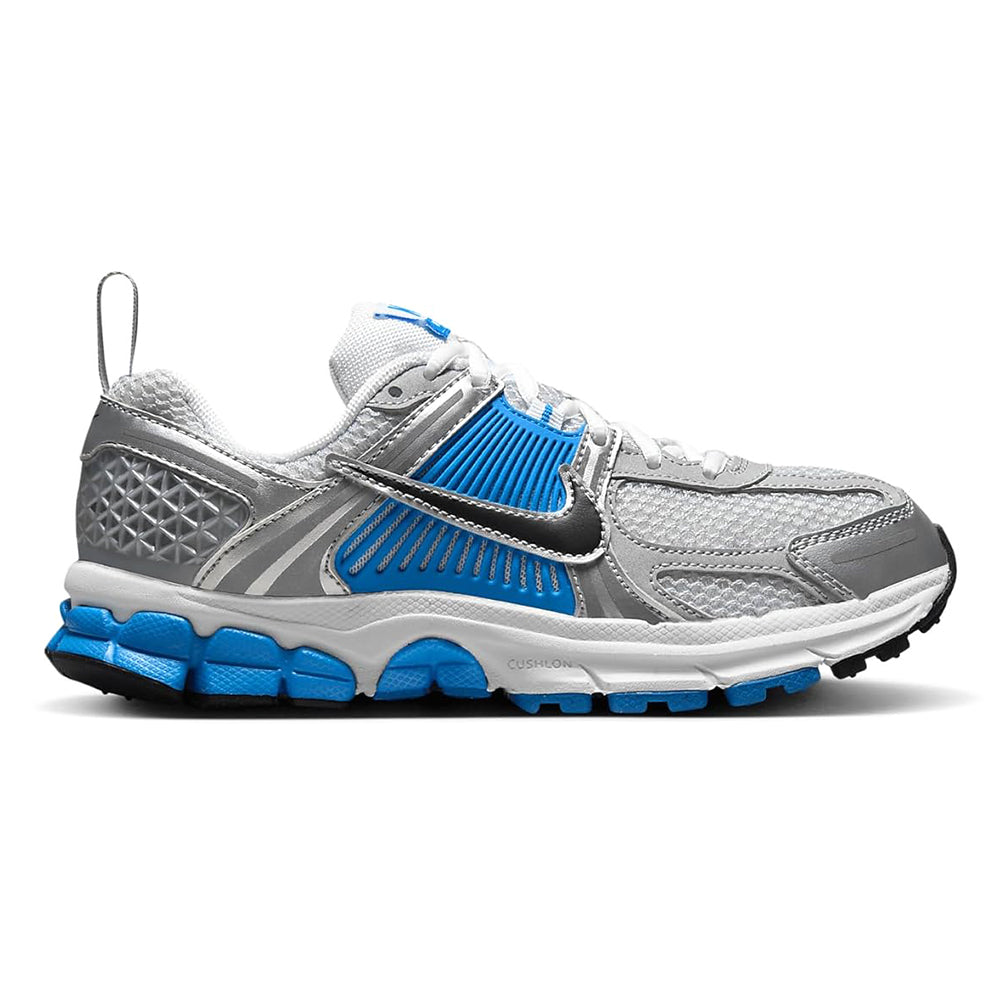 Big kid Nike Vomero 5 side view, grey mesh upper with black swoosh and blue laces