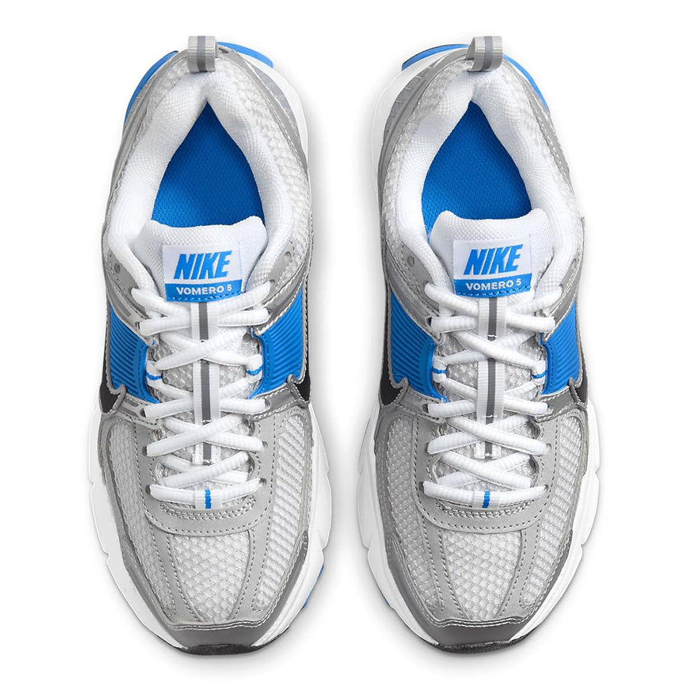 Big kid Nike Vomero 5 tongue and heel, white laces with blue lining and Nike logo