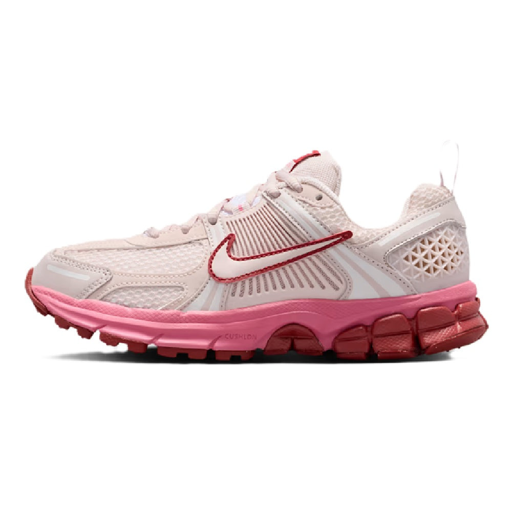Kids lace-up running sneakers in light beige with red swoosh and pink outsole