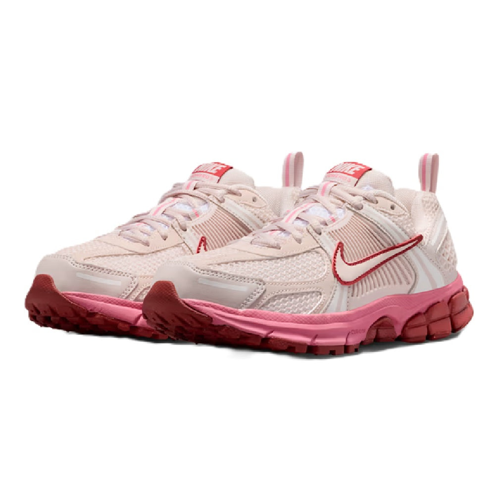 Pair of kids running sneakers in light beige with red accents and pink outsoles
