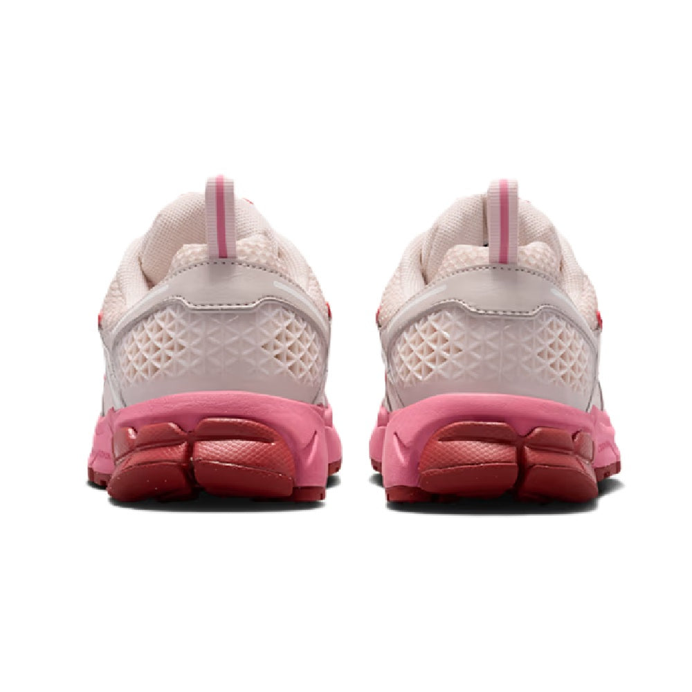 Kids sneaker heel view in light beige with pink heel panel and cushioned collar
