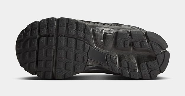 Kids' Nike Vomero 5 black sneakers with textured traction outsole underside