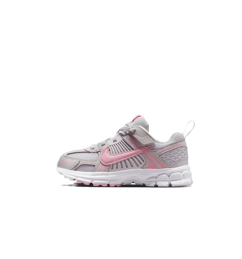Kids' Nike running shoes with gray mesh and pink accents, front side view