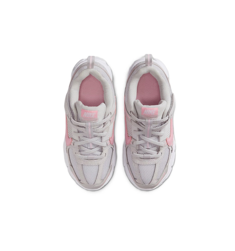 Kids' Nike running shoes, top view with pink lining and gray laces