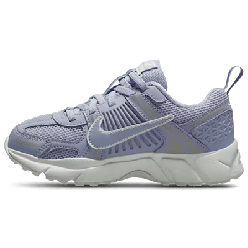 Kids Nike Vomero 5 lace-up sneaker with light purple/gray mesh upper and white midsole.