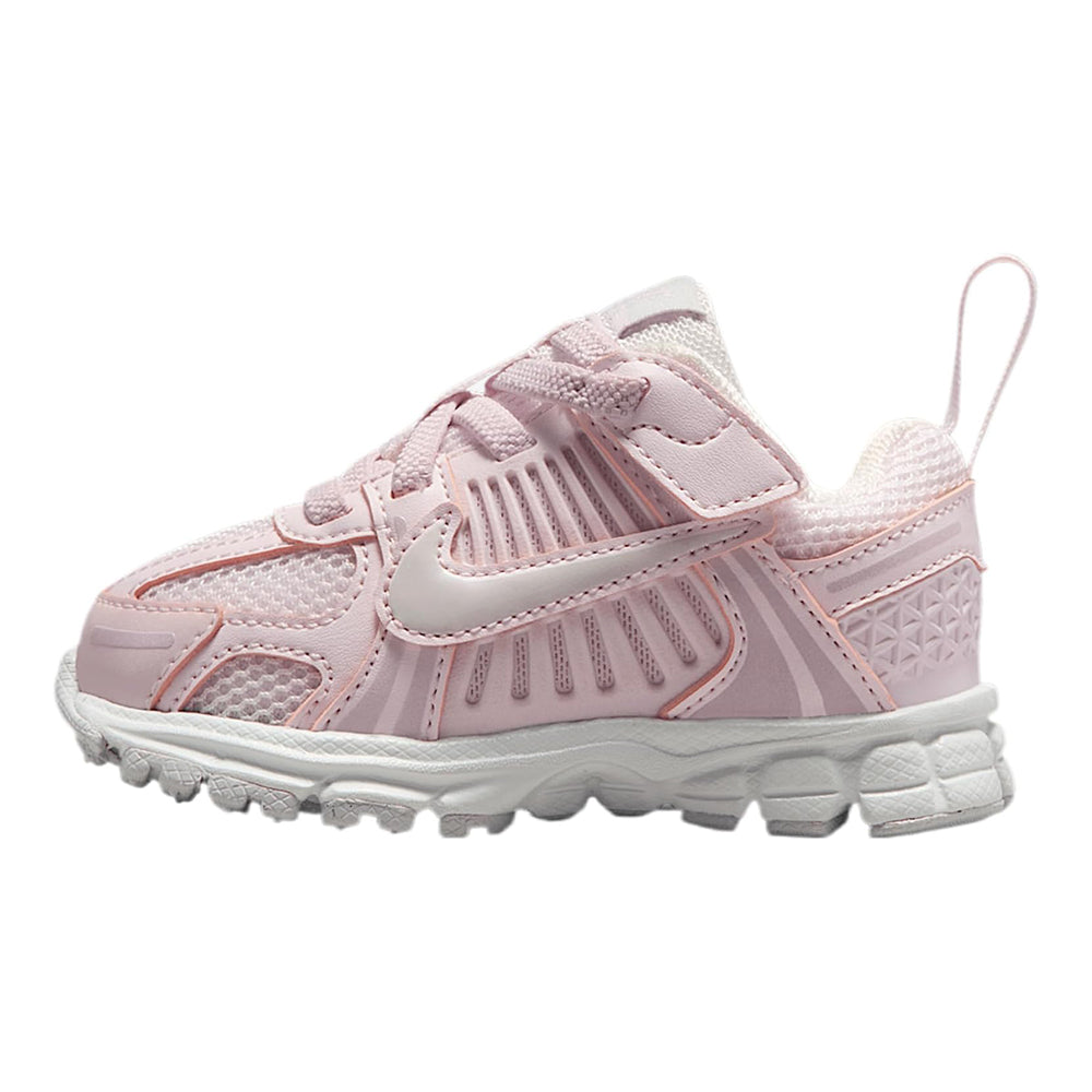 Toddler pink running sneakers with Nike swoosh, lace-up and Velcro strap