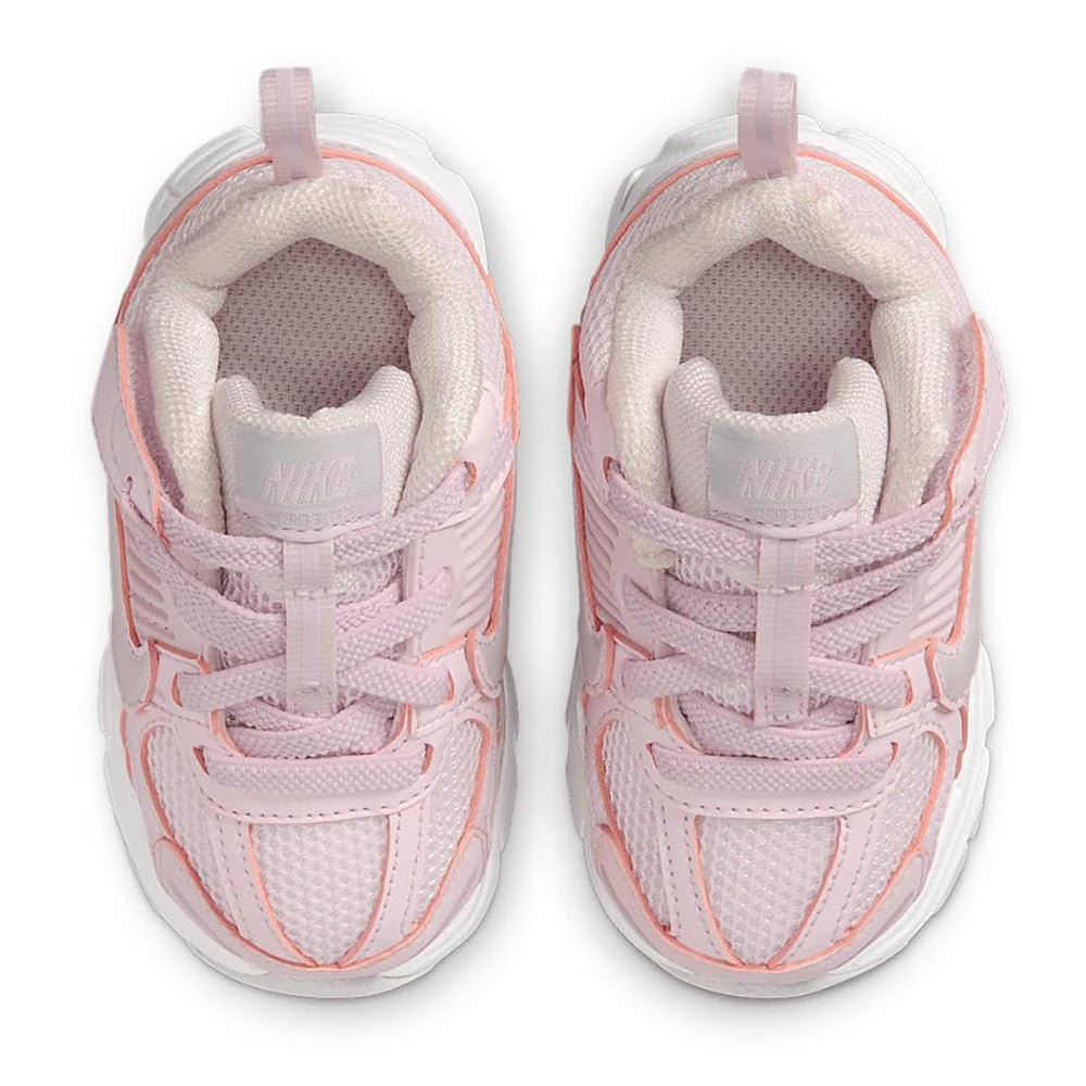 Toddler pink sneakers showing padded mesh lining and lace loops