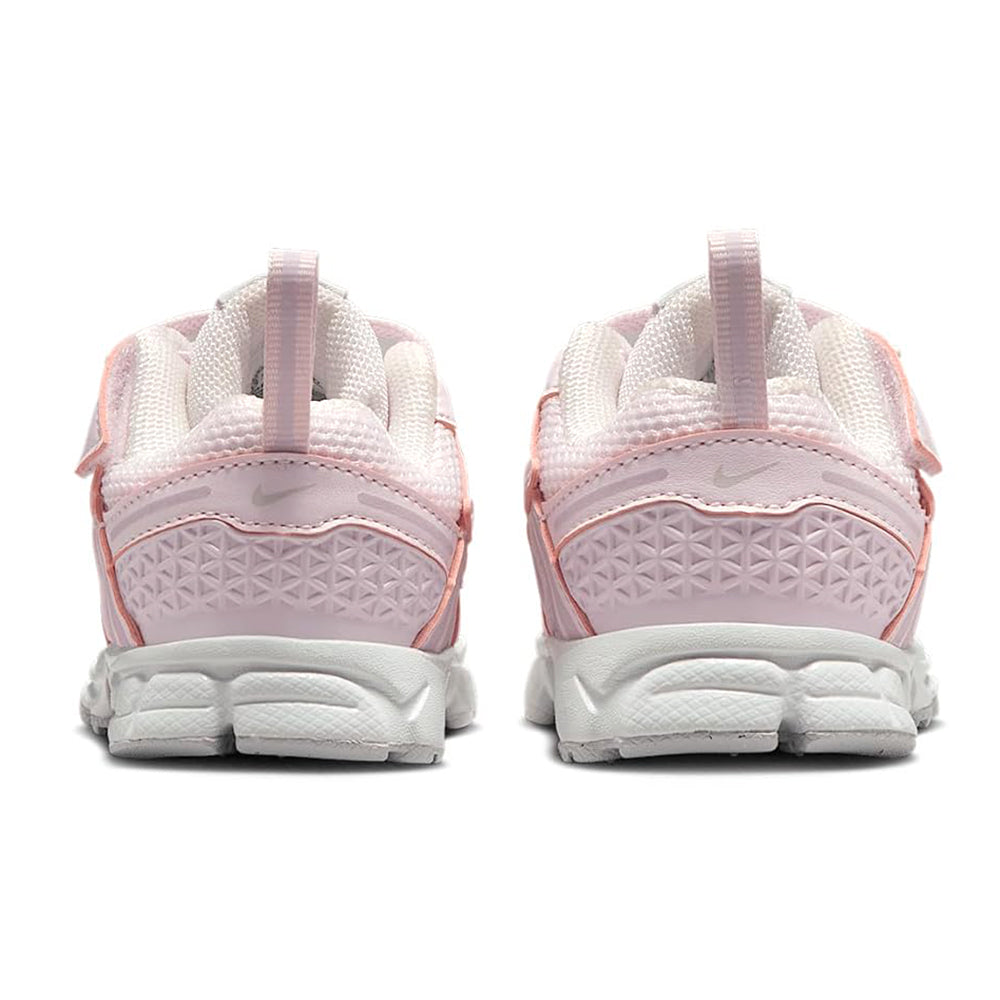 Toddler pink sneakers showing back heel padding and textured side panels