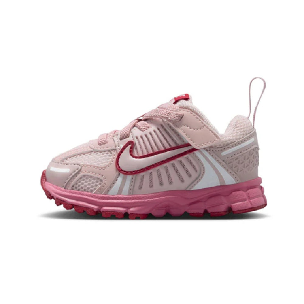 Toddler Nike Vomero 5 running shoes in light pink with pink/red accents and lace-up closure.