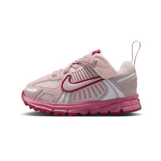 Toddler Nike Vomero 5 running shoes in light pink with pink/red accents and lace-up closure.