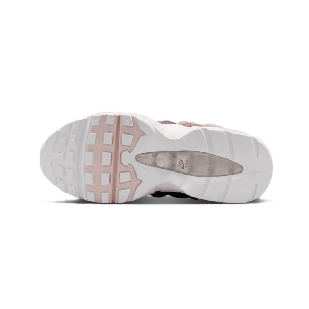 Big kid Air Max 95 outsole view with white tread, translucent pink window, dark maroon upper