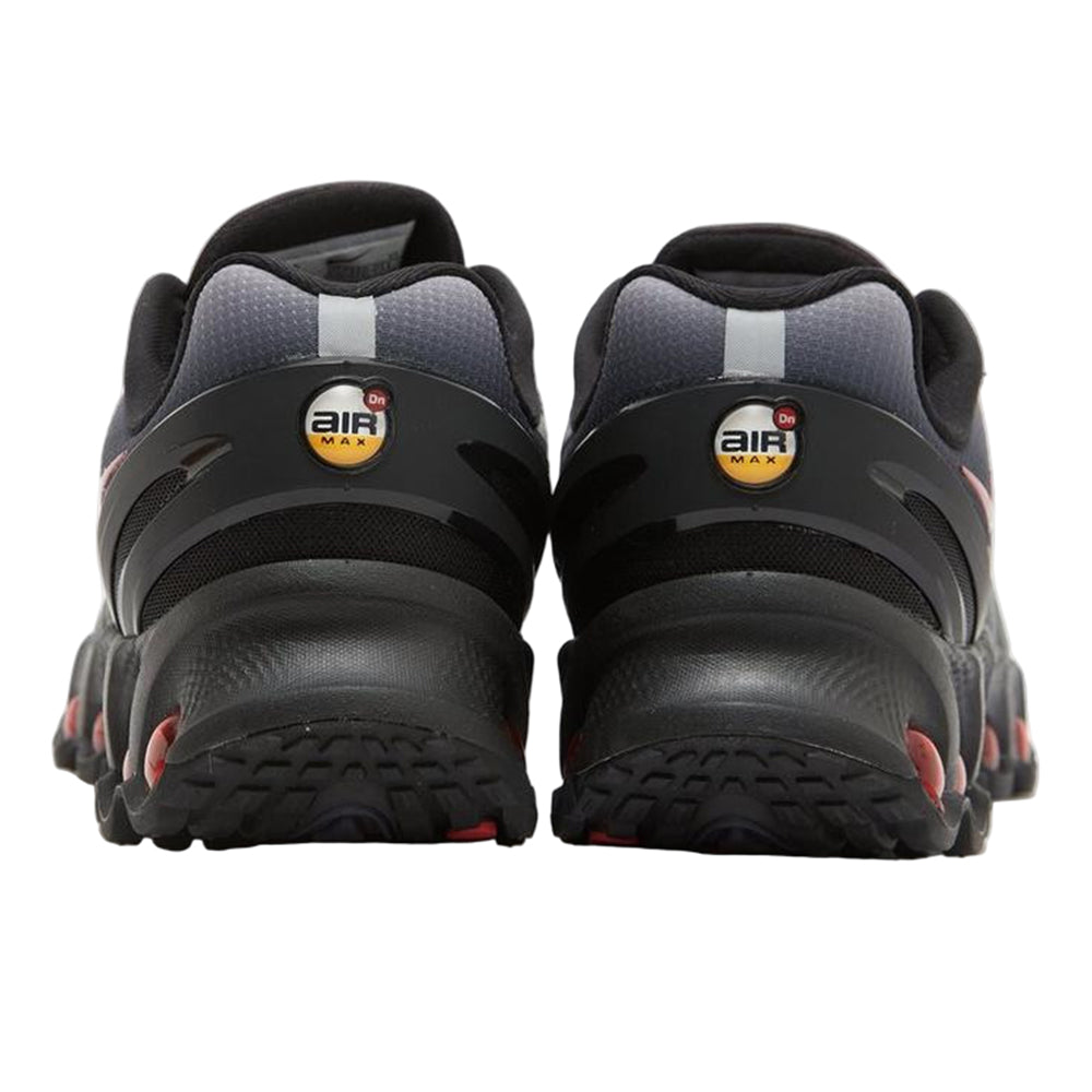 Big kid's Nike Air Max DN8 sneakers, rear view with Air Max heel logos and red pods