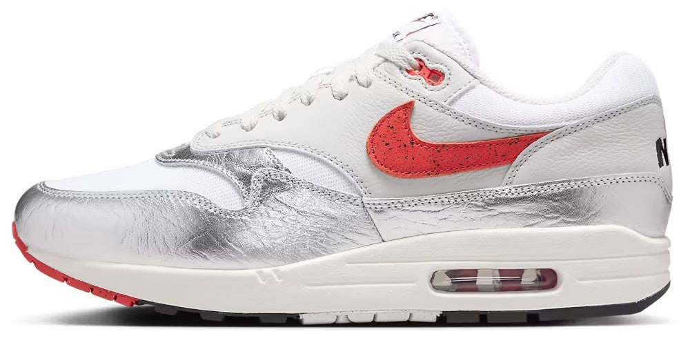 Men's Nike Air Max 1 PRM sneakers in white with red swoosh and visible Air unit